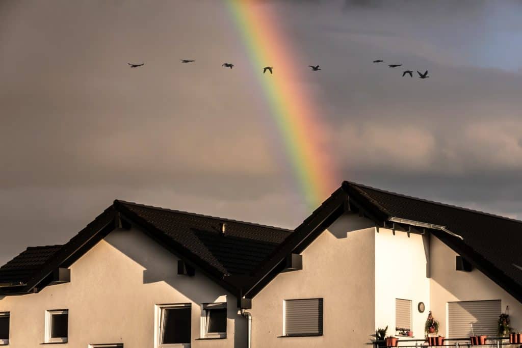 Rainbow over cloudy skies